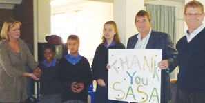 L to R: Gina Sloane (teacher at Bel Porto); students of the school; Koos van Rooyen and Dave Waywell